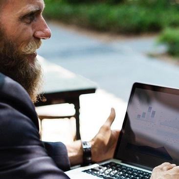 Man with beard typing